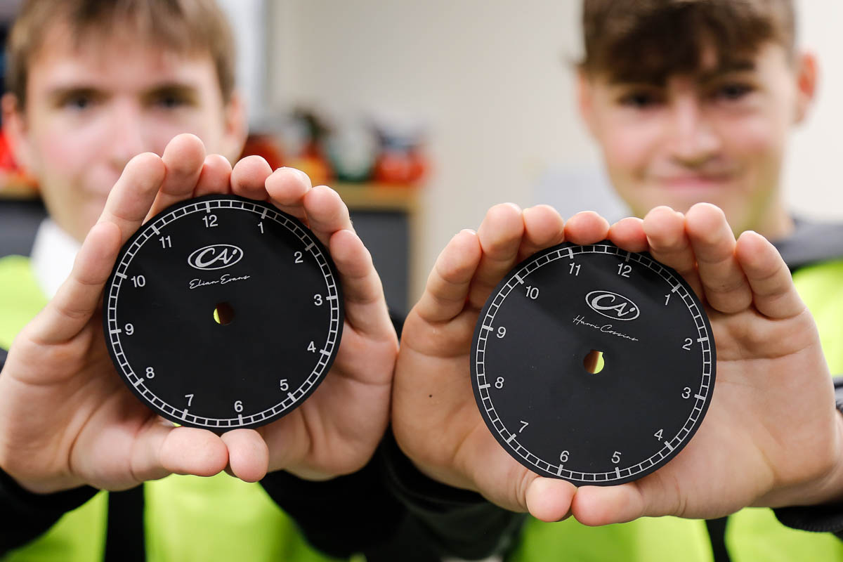 Students with laser engraved gauges faces